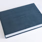 Deep Sea Blue velvet coffee table book with engraved cover text